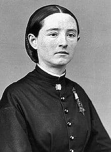 Mary Walker sits for a posed photograph. She is young but is wearing her Medal of Honor so this picture would have been taken after the War.
