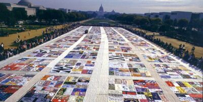 This shows the immense size of the AIDS quilt that stretches for blocks and blocks. The photograph is in color and from above, so it's difficult to see much detail, but you do get a feeling for the expanse of the quilt.