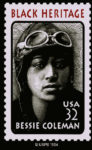 U.S. 32-cent postage stamp to honor Bessie Coleman for Black Heritage month. She is in a flight suit with goggles resting atop her head.