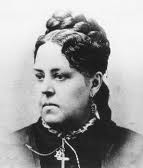This is a posed photograph of Esther Howland. Perhaps it was used for press on the cards.