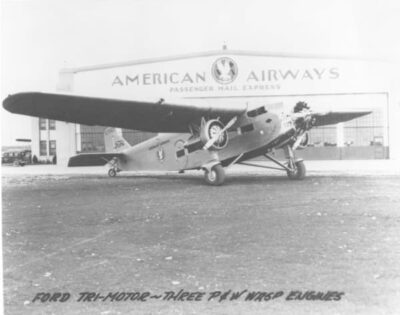 This is an early Trimotor plane in San Diego. It is parked in front of "American Airways" and could have carried passengers.