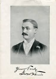 A black-and-white portrait photo of George Ferris. He is well-dressed and sports a bushy black mustache.