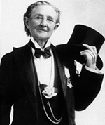 Mry Walker appears to be in a formal jacket and tails. She holds a stovepipe hat in her left hand.