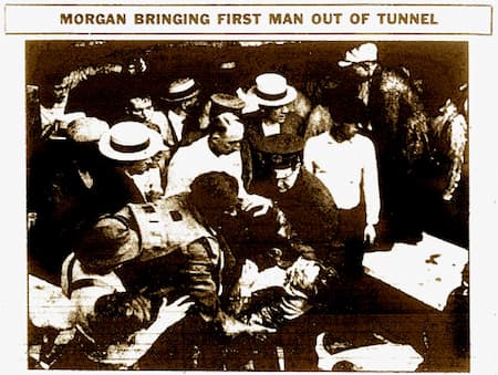 This is a newspaper clipping of a photo of Garrett Morgan bringing the first man out of the tunnel that had collapsed on workers in Cleveland.