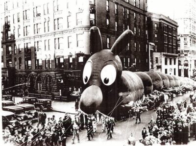 a black-and-white photo of what looks like a caterpillar, although some sources identify it as a "serpent." The date is 1929.
