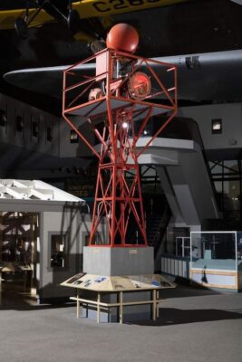 Color photo of a museum exhibit of today that shows what an airway beacon is like.