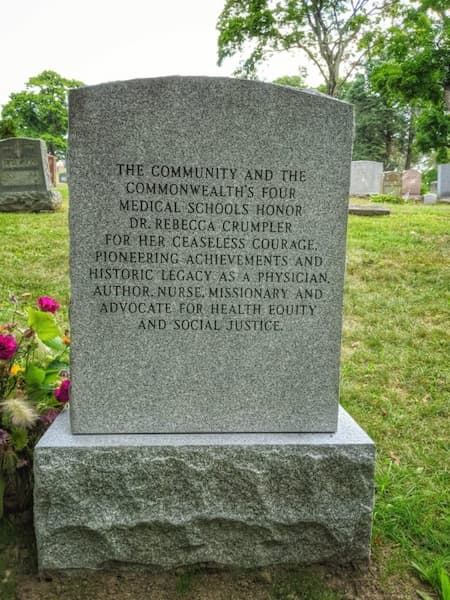 This is the back view of Rebecca Crumpler's tombstone where the town honors her for her ceaseless courage, pioneering achievements and historic legay as a physician, author, nurse, missionary and advocate for heatly equity and social justice.