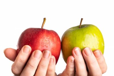 One red and one green apple looking ready to eat.