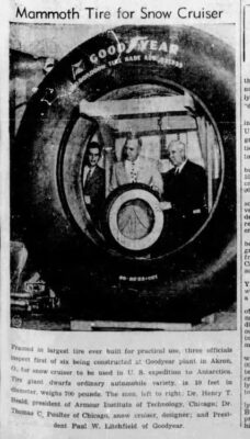 Men showing how big the Goodyear tires were.