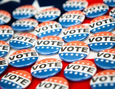 A color photo of buttons that say "VOTE"